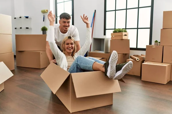 Young Caucasian Couple Smiling Happy Playing Cardboard Box Car New — Stock Photo, Image