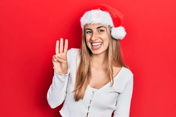 Güzel Spanyol Kadın Noel Şapkası Takıyor Numaralı Parmaklarıyla Işaret Ederken — Stok fotoğraf
