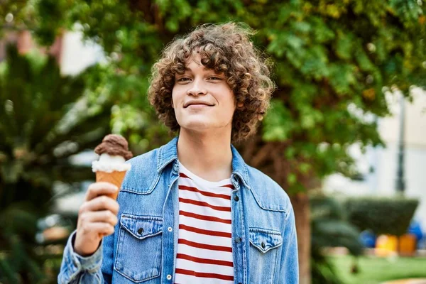 Young Hispanic Man Eating Ice Cream Cone Park — Stockfoto