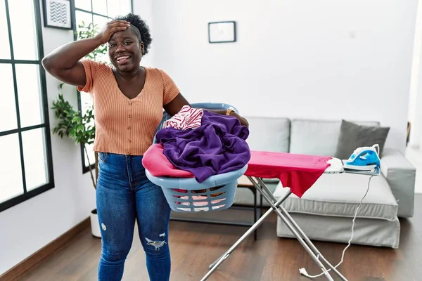 Young African Woman Holding Laundry Basket Home Stressed Frustrated Hand — ストック写真