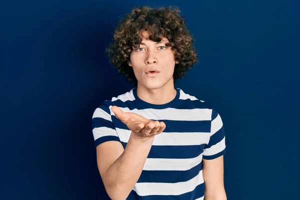 Handsome Young Man Wearing Casual Striped Shirt Looking Camera Blowing — Stock Photo, Image