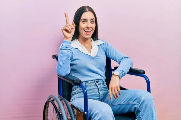 Beautiful Woman Blue Eyes Sitting Wheelchair Pointing Finger Successful Idea — 图库照片