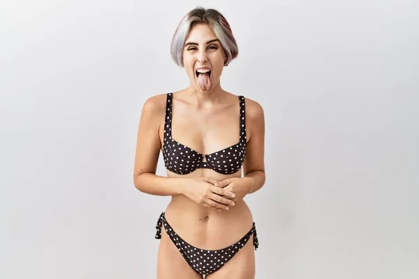 Young Beautiful Woman Wearing Swimsuit Isolated Background Sticking Tongue Out — Stock fotografie