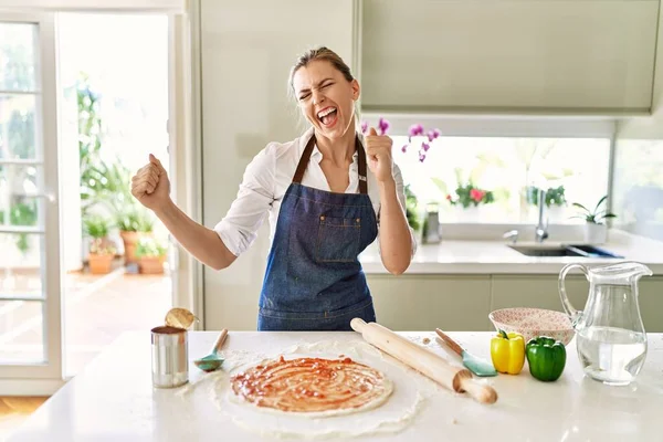Beautiful Blonde Woman Wearing Apron Cooking Pizza Very Happy Excited — Stok fotoğraf