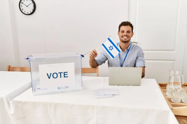 Young Hispanic Man Smiling Confident Holding Israel Flag Working Electoral — Stockfoto