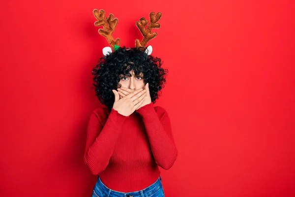 Young Middle East Woman Wearing Cute Christmas Reindeer Horns Shocked — Photo
