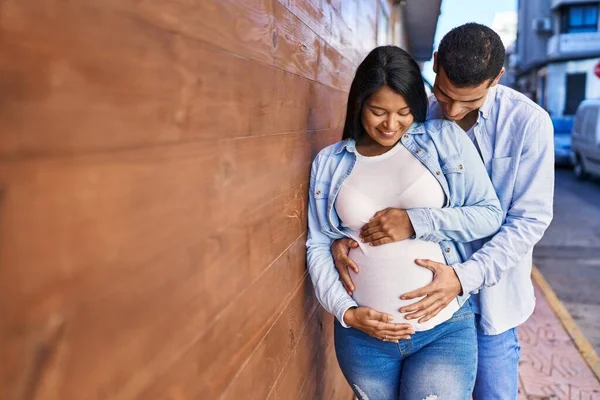 Young Latin Couple Expecting Baby Touching Belly Street — Stockfoto