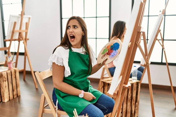 Young Hispanic Artist Women Painting Canvas Art Studio Angry Mad — Stockfoto
