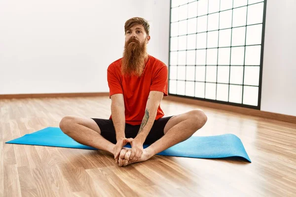 Young Redhead Man Stretching Sport Center — Stock Photo, Image