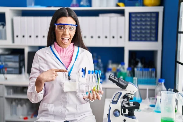 Young Brunette Woman Working Scientist Laboratory Smiling Happy Pointing Hand — стоковое фото