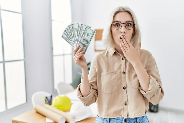 Young Beautiful Caucasian Woman Construction Office Holding Money Covering Mouth — 스톡 사진