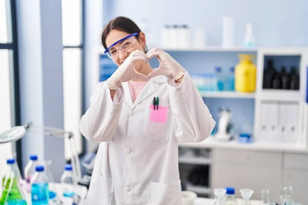 Young Brunette Woman Working Scientist Laboratory Smiling Love Doing Heart — Stock Photo, Image