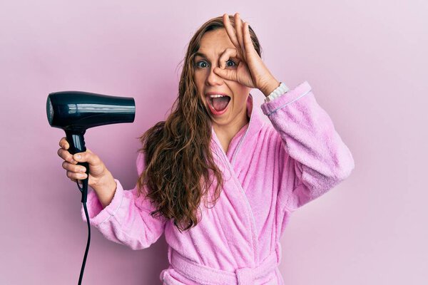 Young Blonde Woman Wearing Bathrobe Using Hair Dryer Smiling Happy Stock Image