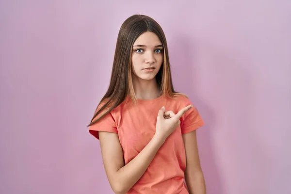 Teenager Girl Standing Pink Background Pointing Aside Worried Nervous Forefinger — Stock Photo, Image