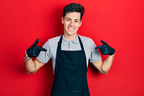Young Hispanic Man Wearing Apron Looking Confident Smile Face Pointing — Stock Photo, Image