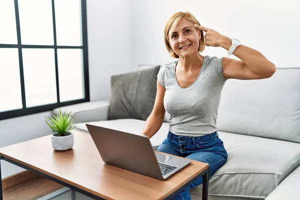 Middle Age Blonde Woman Using Laptop Home Smiling Pointing Head —  Fotos de Stock