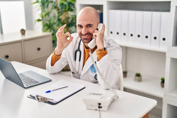 Young Bald Man Beard Working Telephone Appointment Doing Sign Fingers — Stock Photo, Image