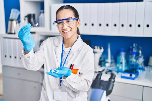 Young Hispanic Woman Scientist Holding Pills Tweezer Laboratory — Stock Photo, Image