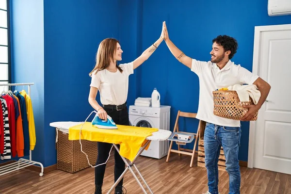 Man Woman Couple High Five Hands Raised Ironing Laundry Room — Fotografia de Stock