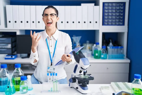 Young Brunette Woman Working Scientist Laboratory Crazy Mad Shouting Yelling — Stockfoto