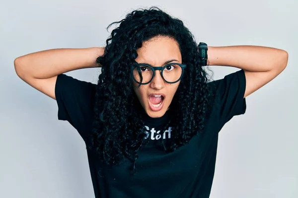 Young Hispanic Woman Curly Hair Wearing Staff Shirt Crazy Scared — Fotografia de Stock