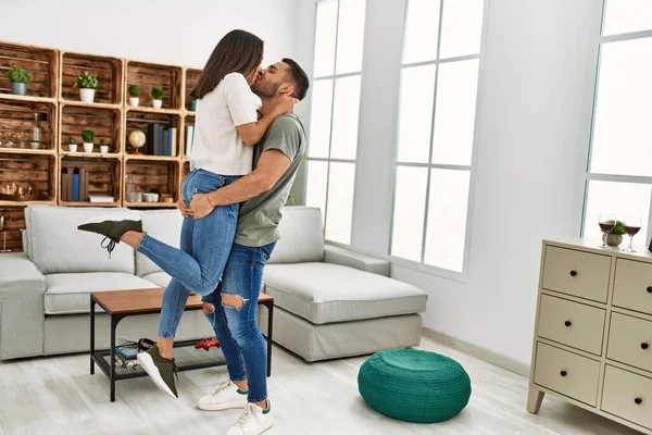 Young Latin Couple Kissing Hugging Home — Stock Photo, Image
