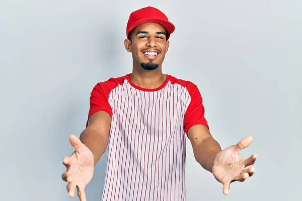 Young African American Man Wearing Baseball Uniform Smiling Making Frame — Stockfoto