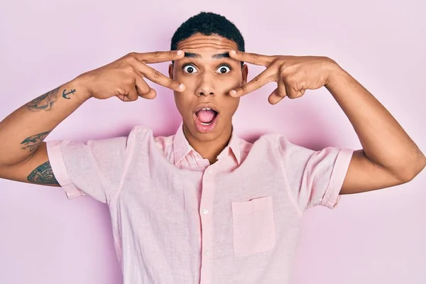 Young African American Guy Doing Victory Sign Peace Gesture Afraid — Stockfoto