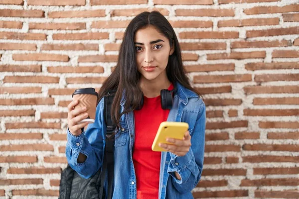 Young Teenager Girl Wearing Student Backpack Using Smartphone Relaxed Serious — Stock Photo, Image