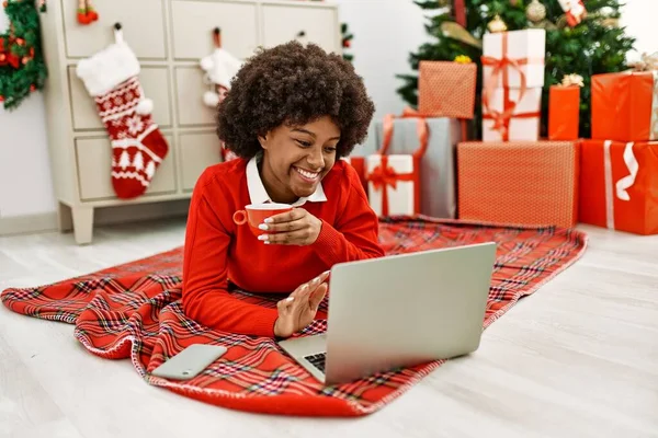Young African American Woman Having Video Call Lying Christmas Tree — Stockfoto