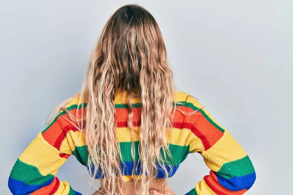 Beautiful Young Blonde Woman Wearing Colored Sweater Standing Backwards Looking — Stock Photo, Image