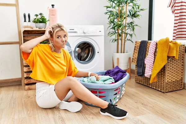 Young Caucasian Woman Putting Dirty Laundry Washing Machine Confuse Wondering — Stockfoto