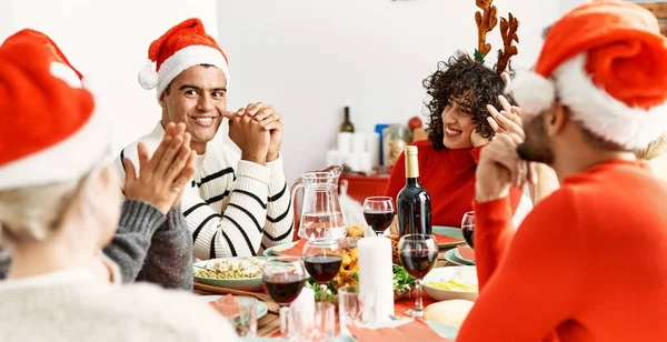 Group Young Friends Having Christmas Dinner Sitting Table Home — ストック写真