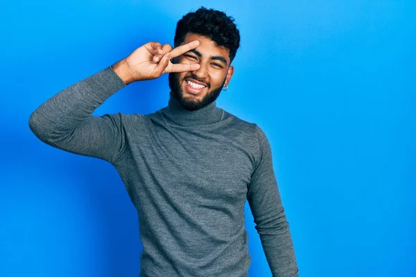 Arab Man Beard Wearing Turtleneck Sweater Doing Peace Symbol Fingers — Stock Fotó