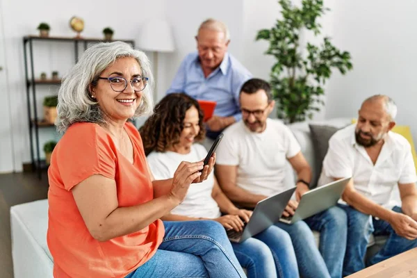 Group Middle Age Friends Using Laptop Smartphone Sitting Sofa Home — Stock Photo, Image