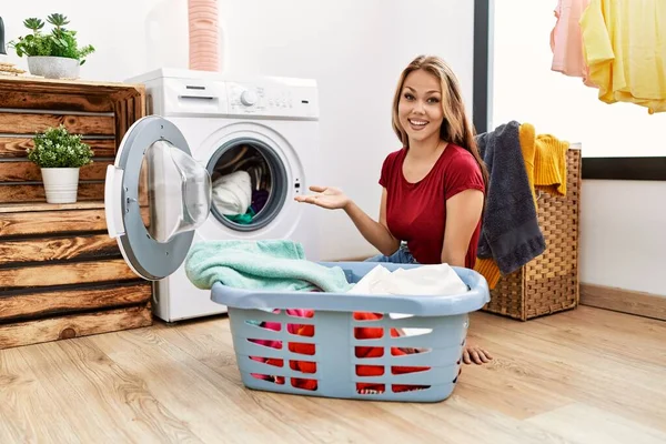 Young Caucasian Woman Putting Dirty Laundry Washing Machine Celebrating Achievement — Stock Photo, Image