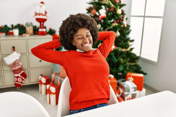 Young African American Woman Relaxed Hands Head Sitting Christmas Tree — Foto de Stock