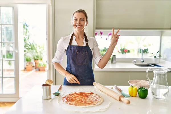 Beautiful Blonde Woman Wearing Apron Cooking Pizza Smiling Happy Face — Stok fotoğraf