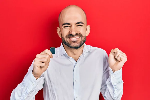 Young Bald Man Holding Sdxc Card Screaming Proud Celebrating Victory — 图库照片