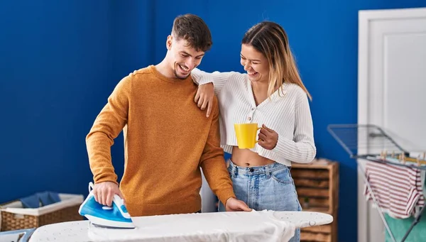 Young Man Woman Couple Ironing Clothes Drinking Coffee Laundry Room — ストック写真