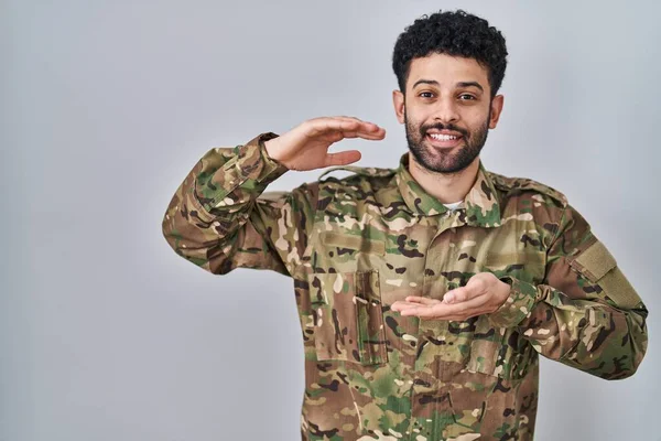 Arab Man Wearing Camouflage Army Uniform Gesturing Hands Showing Big — Stock Photo, Image