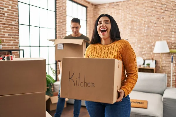 Young Couple Moving New Home Cardboard Boxes Smiling Laughing Hard — Stock Photo, Image