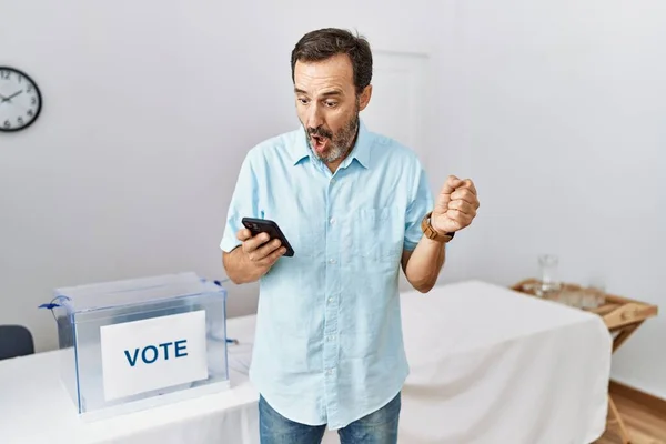 Middle Age Man Beard Political Election Using Smartphone Scared Amazed — Stock Photo, Image