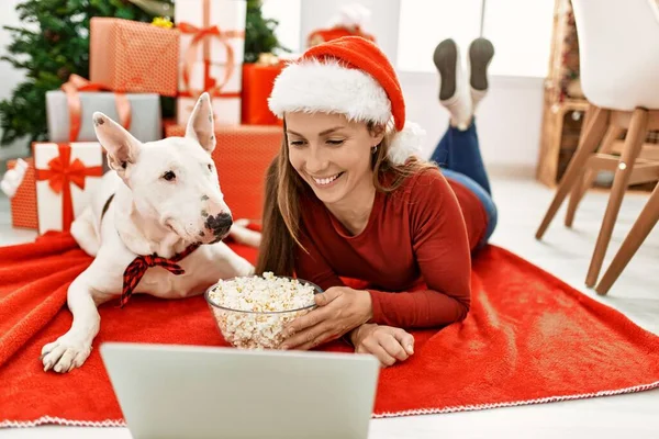 Young Caucasian Woman Watching Movie Lying Dog Christmas Tree Home — Stok fotoğraf