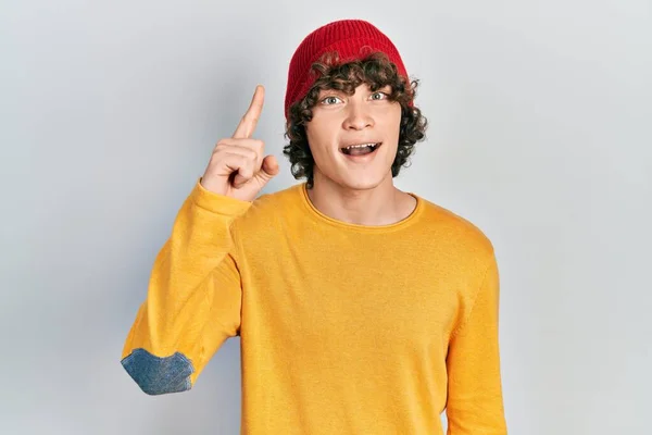 Handsome Young Man Wearing Wool Hat Pointing Finger Successful Idea — Stock Photo, Image