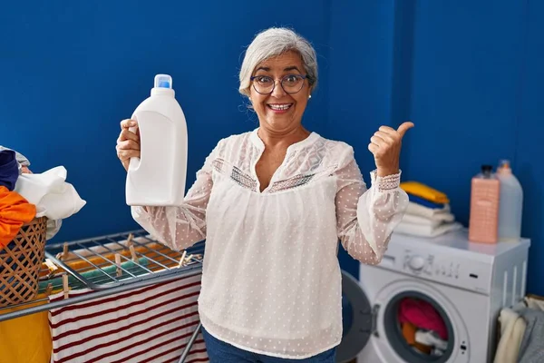 Middle Age Woman Grey Hair Doing Laundry Detergent Bottle Pointing — Stock Photo, Image