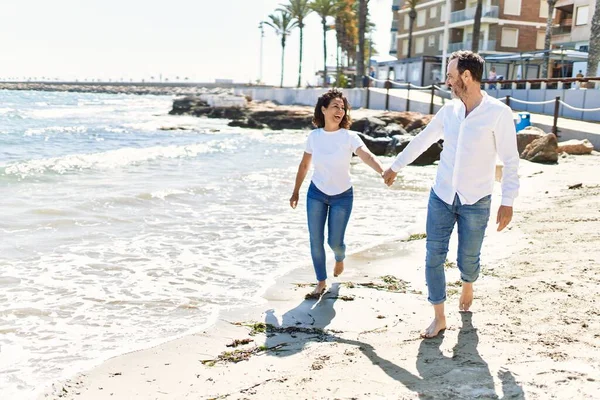 Middle Age Hispanic Couple Smiling Happy Walking Hands Together Beach — Stock fotografie