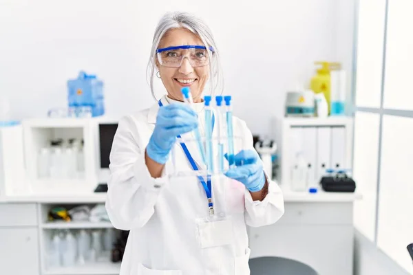 Middle Age Grey Haired Woman Wearing Scientist Uniform Using Laptop — Stock Photo, Image