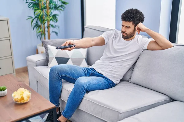 Young Arab Man Watching Movie Sitting Sofa Home — Photo
