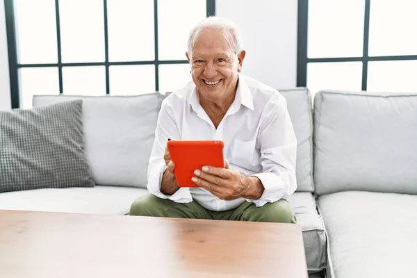 Senior Man Smiling Confident Using Touchpad Home — ストック写真